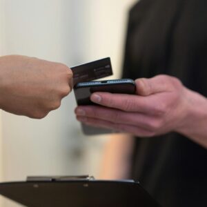 A contactless payment transaction using a smartphone scanner in an indoor setting.
